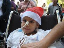 Paciente com nosso gorro de Papai Noel: extraí um sorriso !
